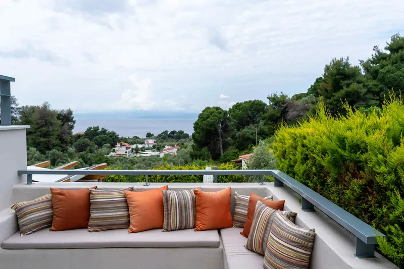 Classic Style Villa: the terrace sofa with the sea and hills beyond