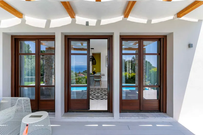 Modern Style Villa: the terrace and glass doors under the pergola