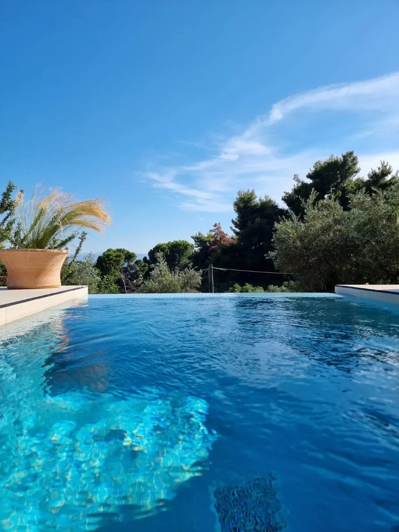 The pool at the Stone Loft Suite under a blue sky